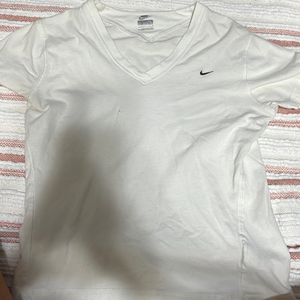 White Nike v-neck t-shirt. Girls medium, fits like a women’s xs